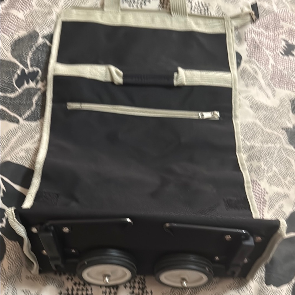 Black and Cream Travel Bag with Wheels for light travel.  Used 2-3 times.